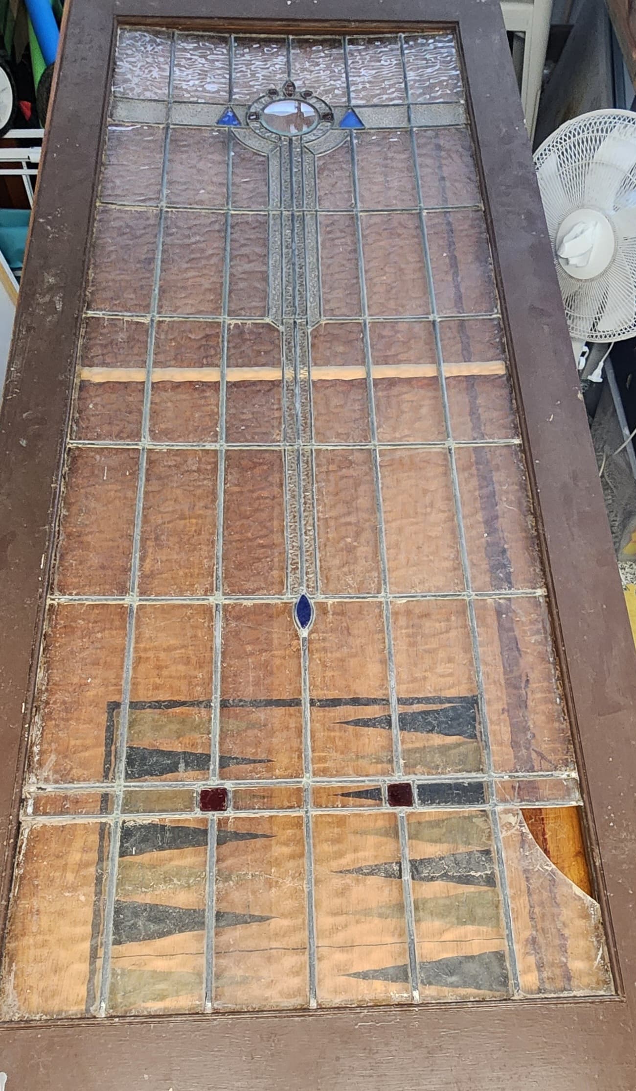 Damaged stained glass before restoration